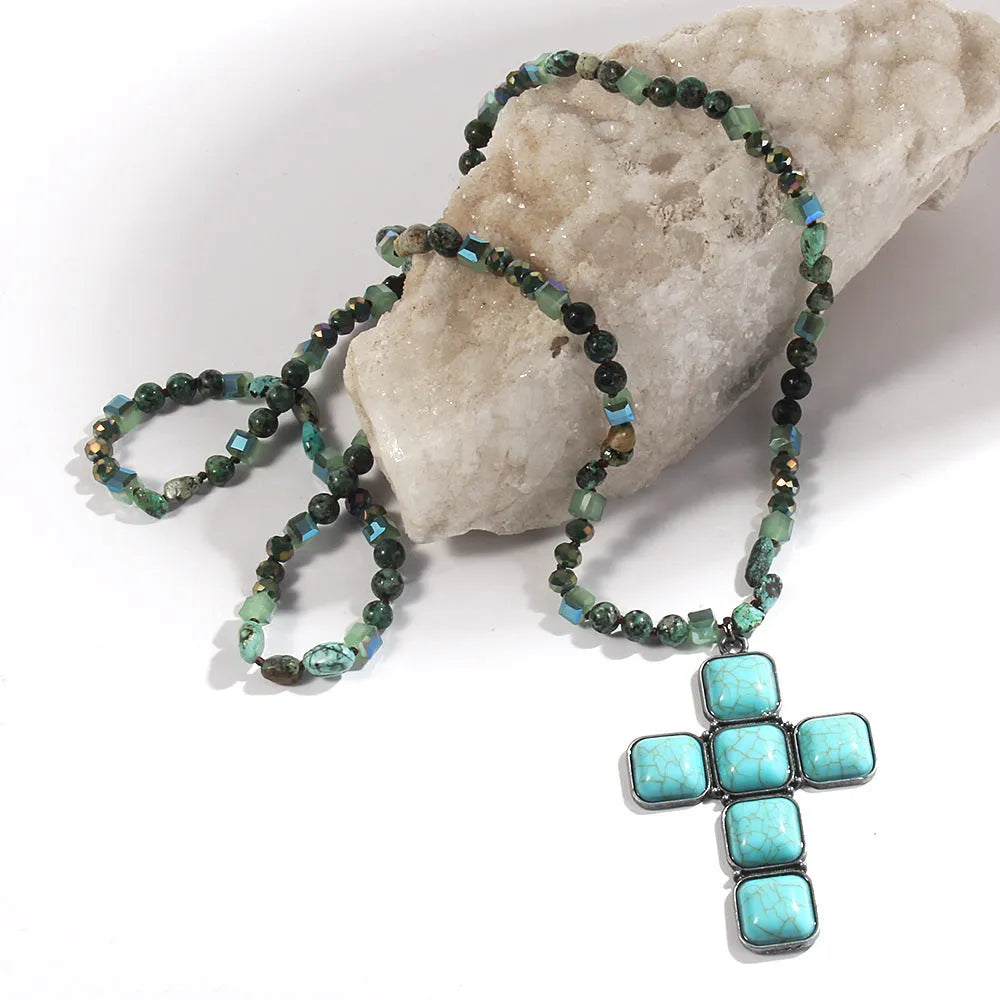 Glass and stone square cross pendant necklace with knotted chain in blue, 81cm long