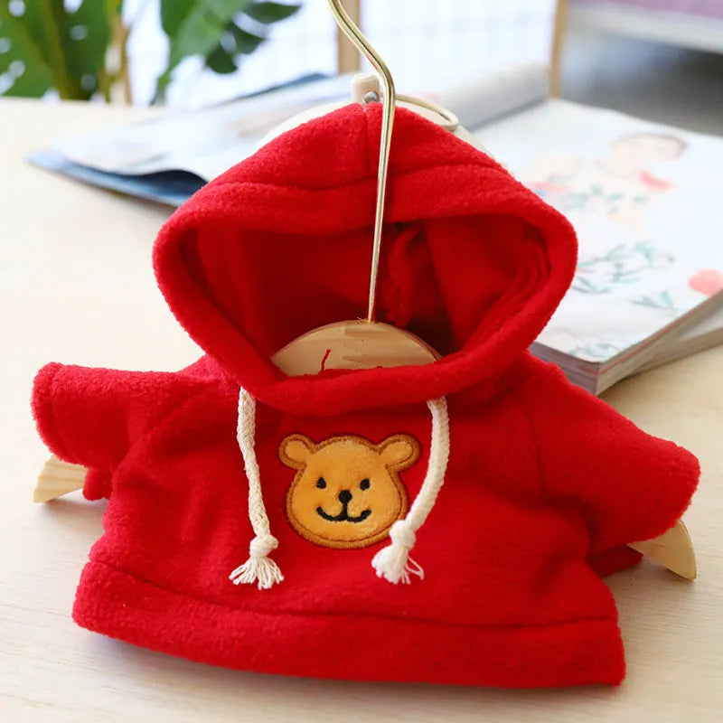 A selection of dog sweaters and hoodies in blue, pink, red, yellow, brown, and grey bear designs, shown in medium and large sizes.