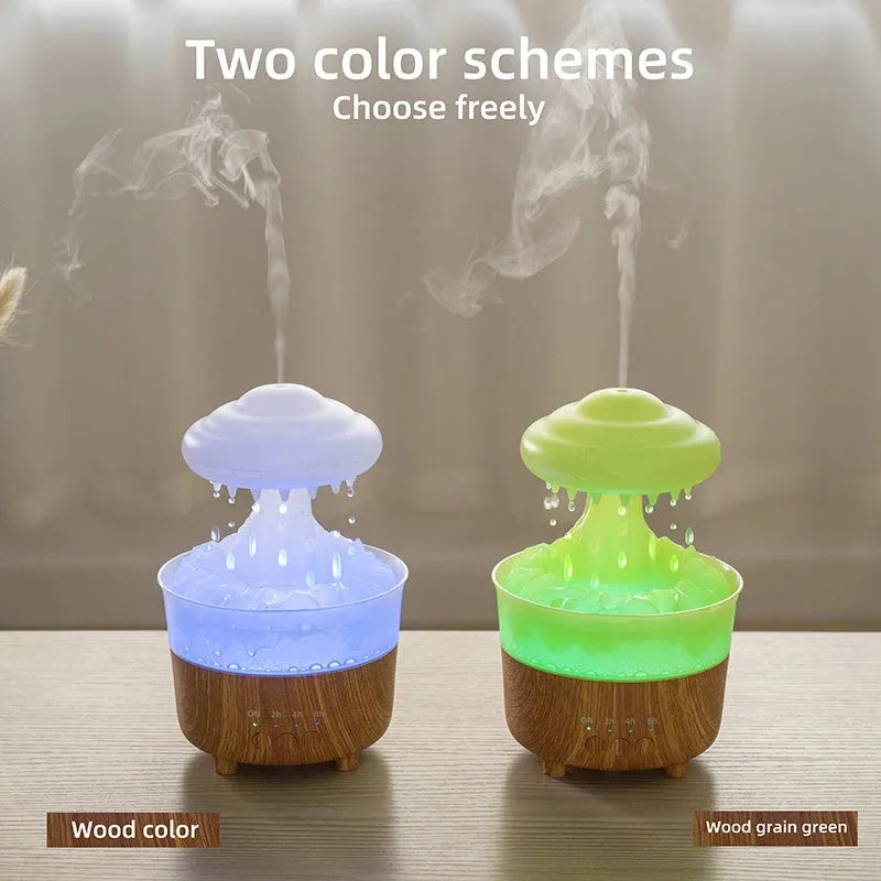 Wood grain white rain cloud shaped humidifier and essential oil diffuser with LED lights on a table.