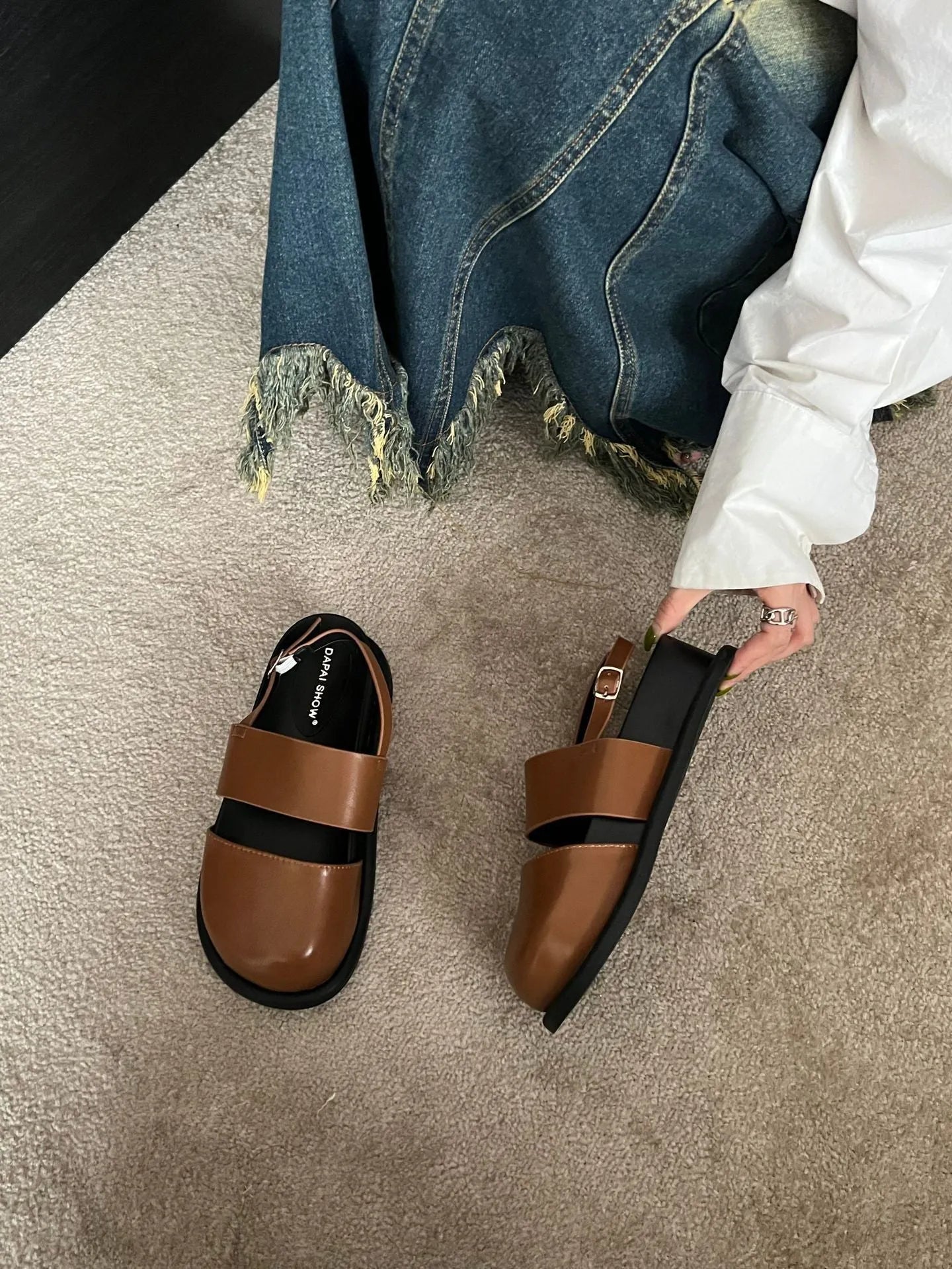 Retro closed toe sandals with raised bottom, ankle strap buckle, and round toe in apricot colour