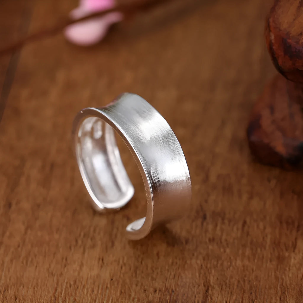 Korean frosted sterling silver geometric open ring with adjustable size on display