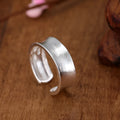 Korean frosted sterling silver geometric open ring with adjustable size on display