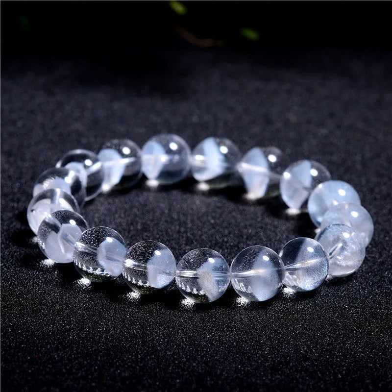Women's white crystal pyramid bracelet with traditional Ruyi element design showing multiple bead sizes