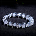 Women's white crystal pyramid bracelet with traditional Ruyi element design showing multiple bead sizes