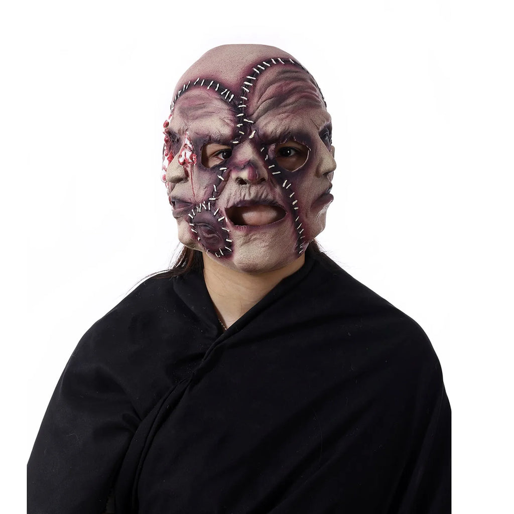 Three-sided grimace horror mask showing three distinct grotesque faces in natural latex