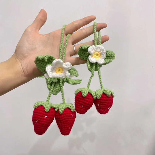 Handmade woven strawberry-shaped car hanging ornament made from cotton and hemp yarn with a Lily of the Valley hook.
