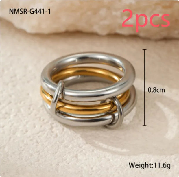Stacked colour matching stainless steel ring set with 18K gold plating and exaggerated profile