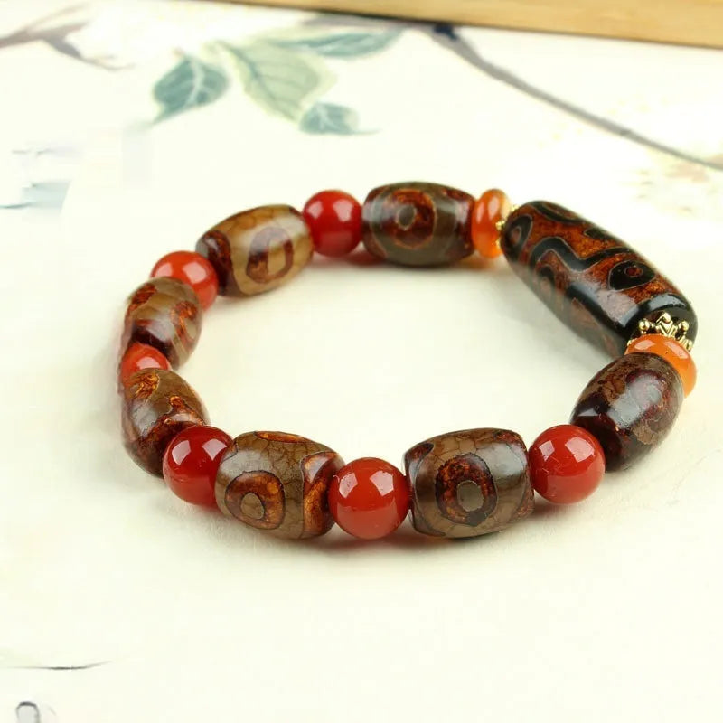Agate Tibetan dzi bead bracelet with three-eye design and polished finish