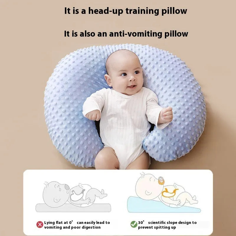 Nursing pillow with integrated spill barrier in a choice of pink, yellow, grey, or light blue colours.