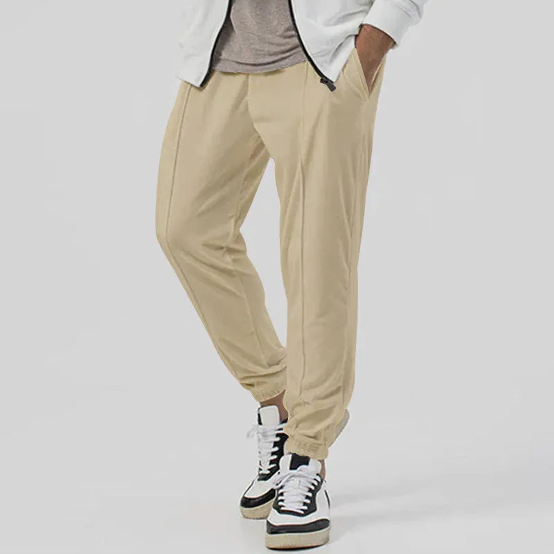Men's casual track sweatpants in loose tapered straight-leg design showing army green colour option