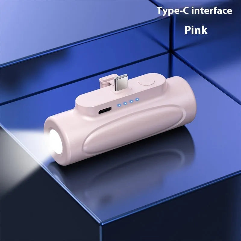 Black and pink creative power bank with LED flashlight, showing Type-C and Apple port options, 83x27x41mm.