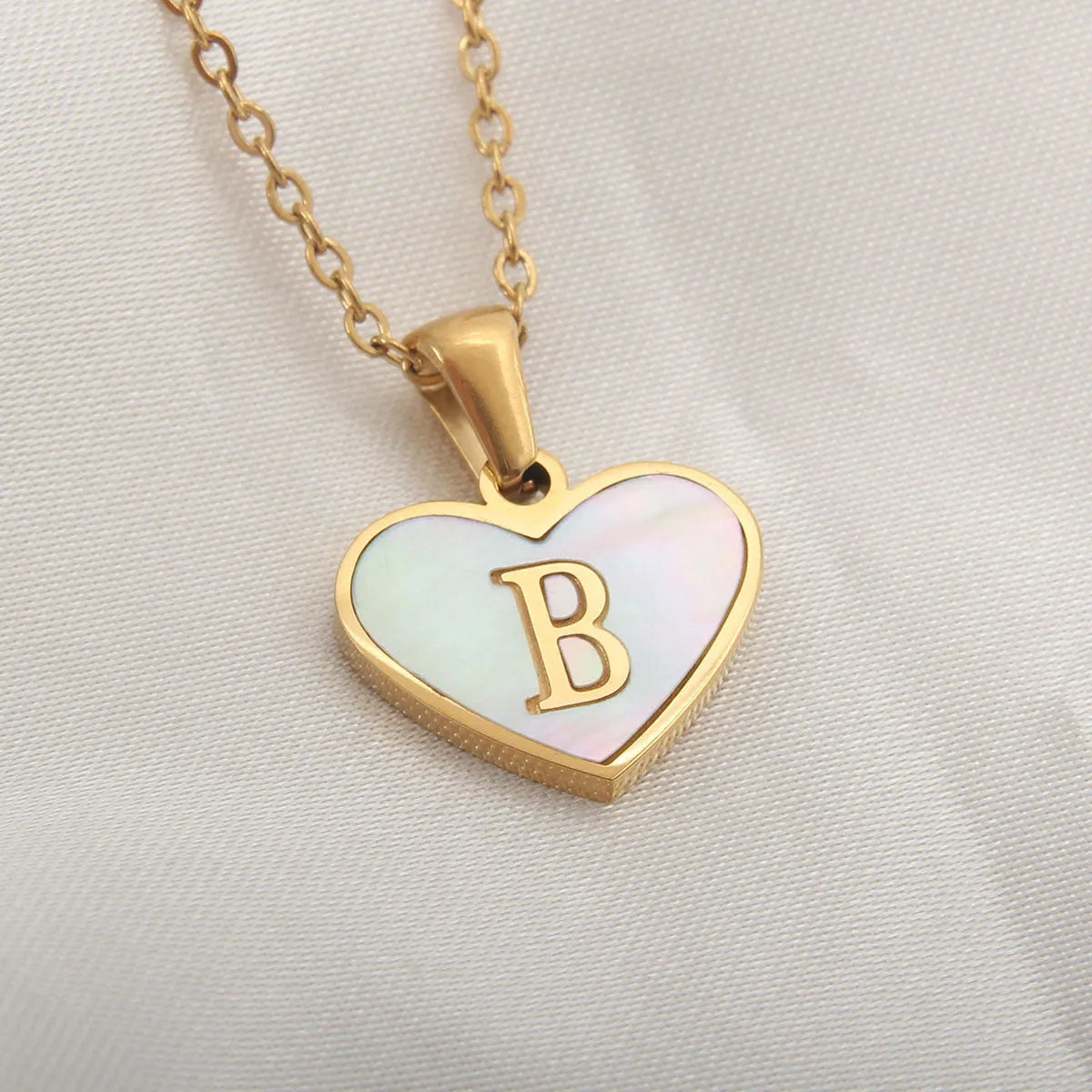Gold plated personalised heart necklace with white shell on a 45cm chain