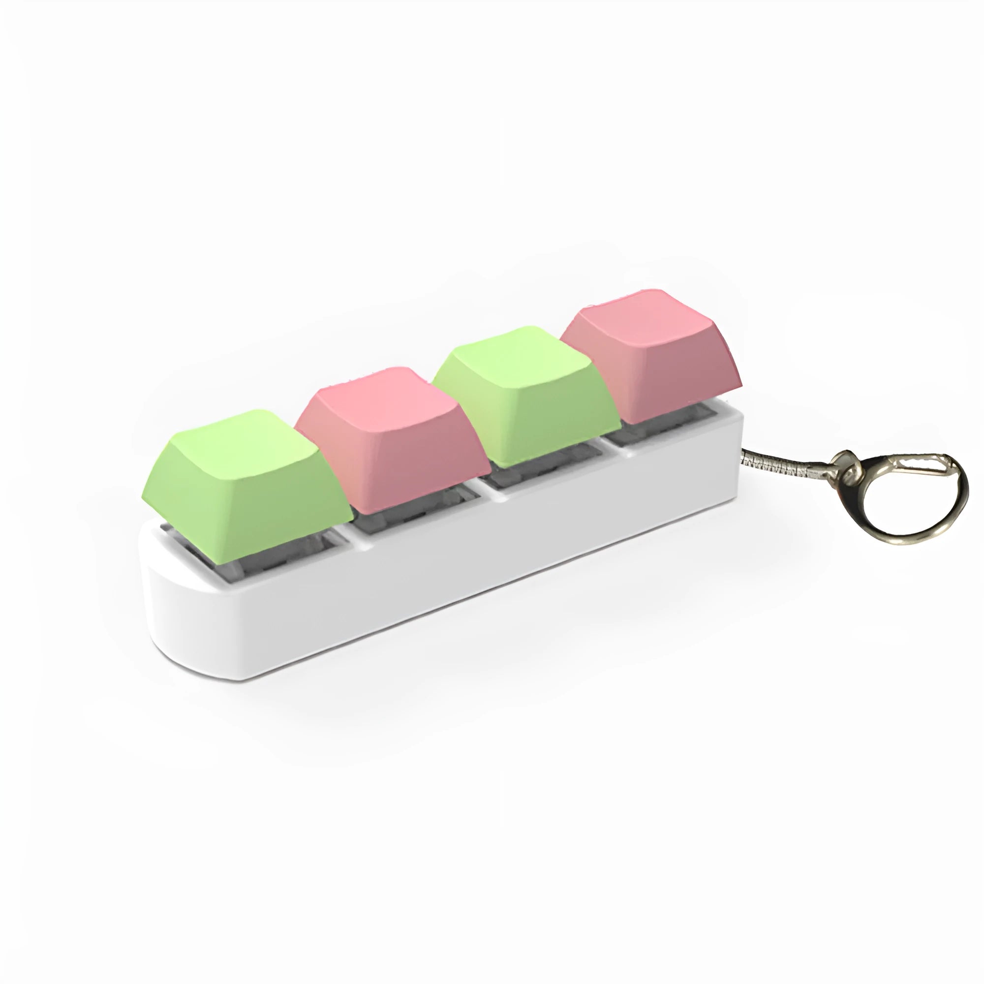 Four-key mechanical keyboard switch tester made of ABS plastic on a desk.