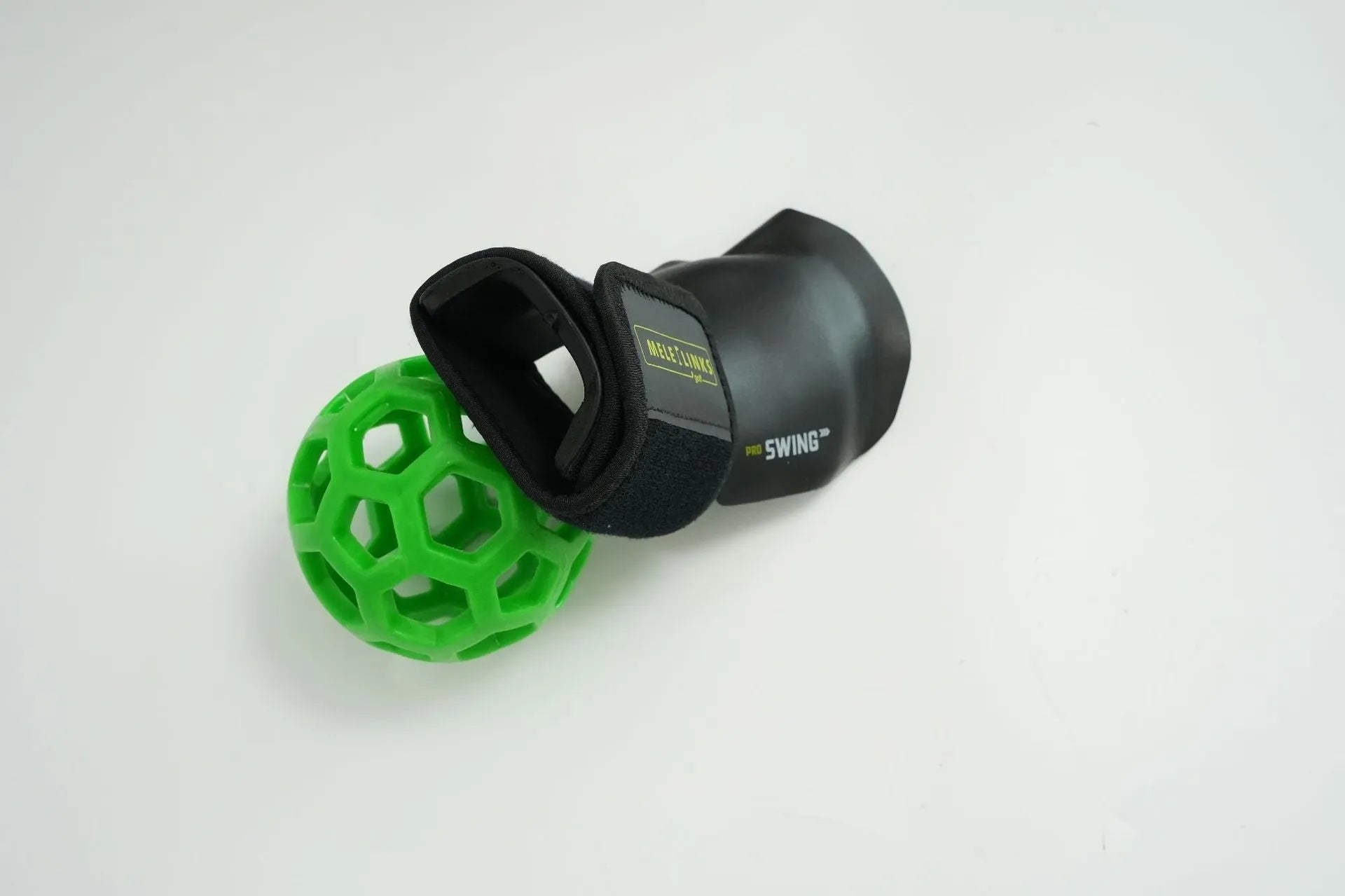Golf swing trainer arm bracket wrist holder with PU foam fabric suit and green ball on white background