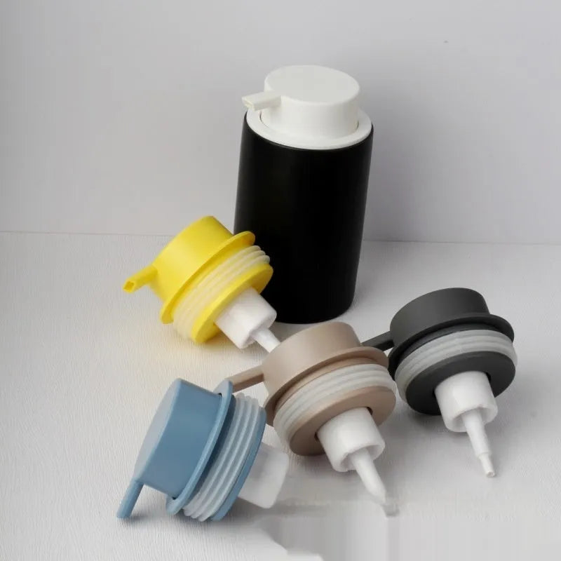 A large-headed foam pump for soap in a metallic gold finish, made from ABS plastic.