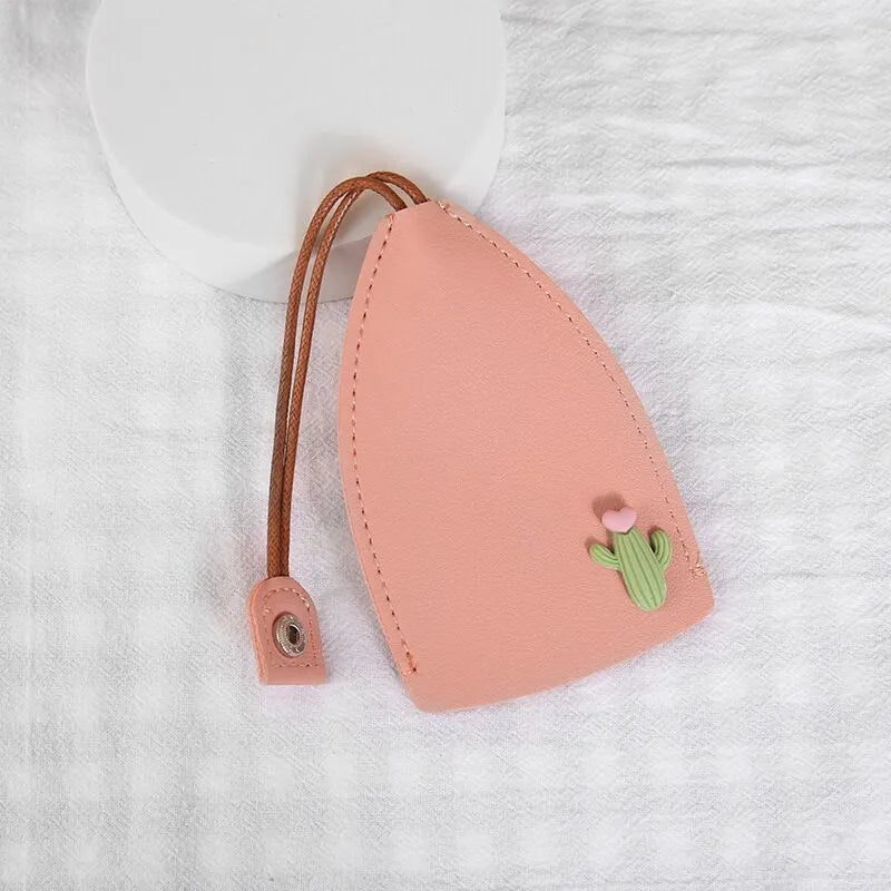 Cartoon pull-out key case in PU leather showing design options including resin fruit and big cartoon animal prints.