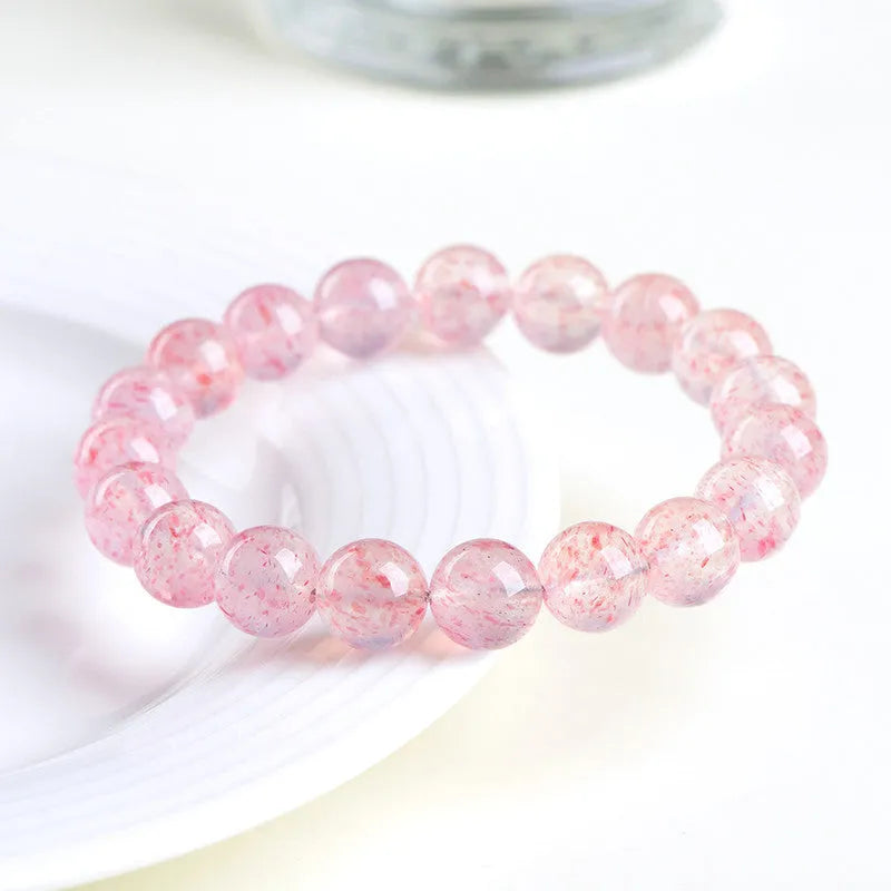 Strawberry quartz crystal bracelet with 10-10.8mm round beads in white water colour