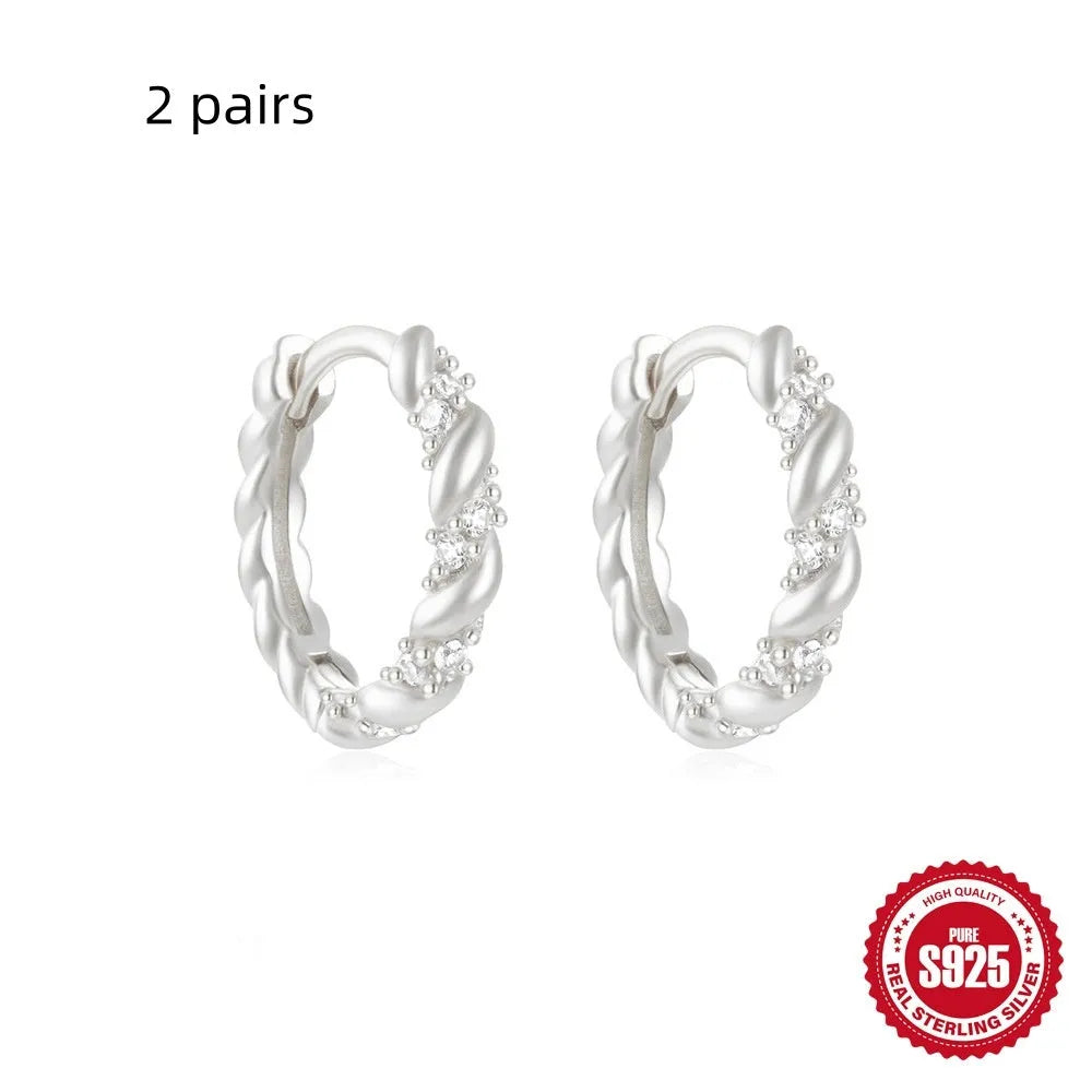 Sterling silver geometric stud earrings with diamond detailing in gold or silver finish