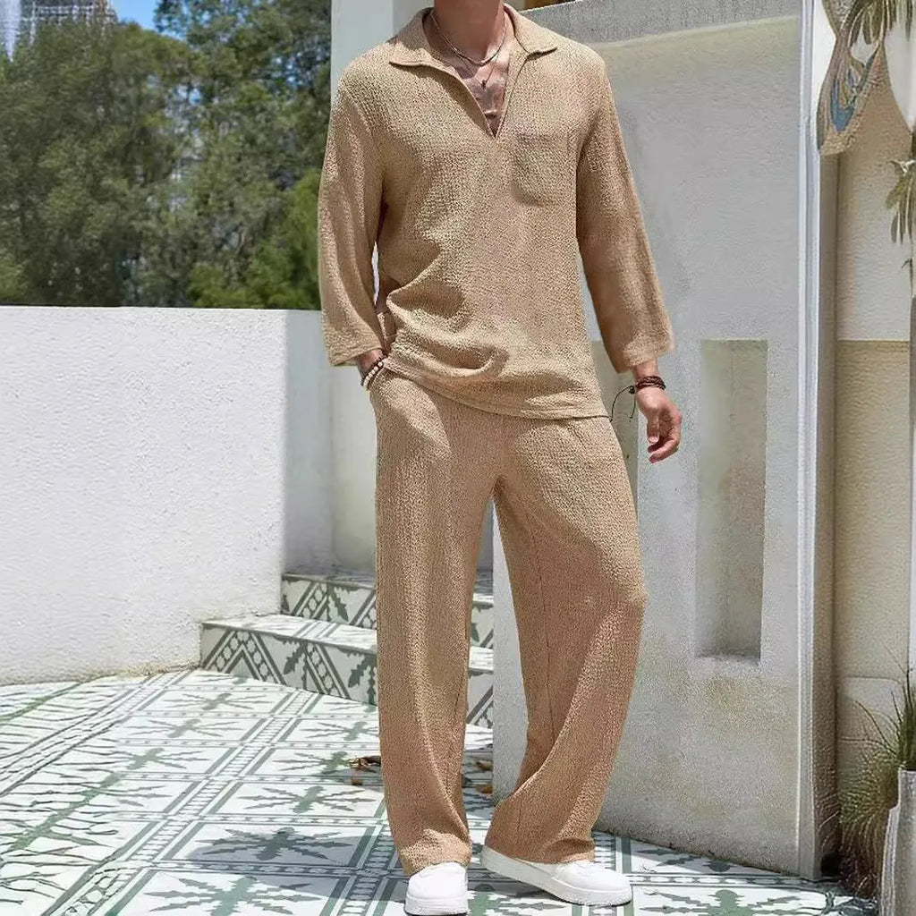 Man wearing a lake blue casual shirt and matching trousers from a polyester suit set.