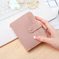 Ladies' short wallet with lychee pattern in beige, showing 2-fold design and card slots