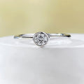 Minimalist silver crown-shaped ring with linear engraving detail in gold or platinum finish