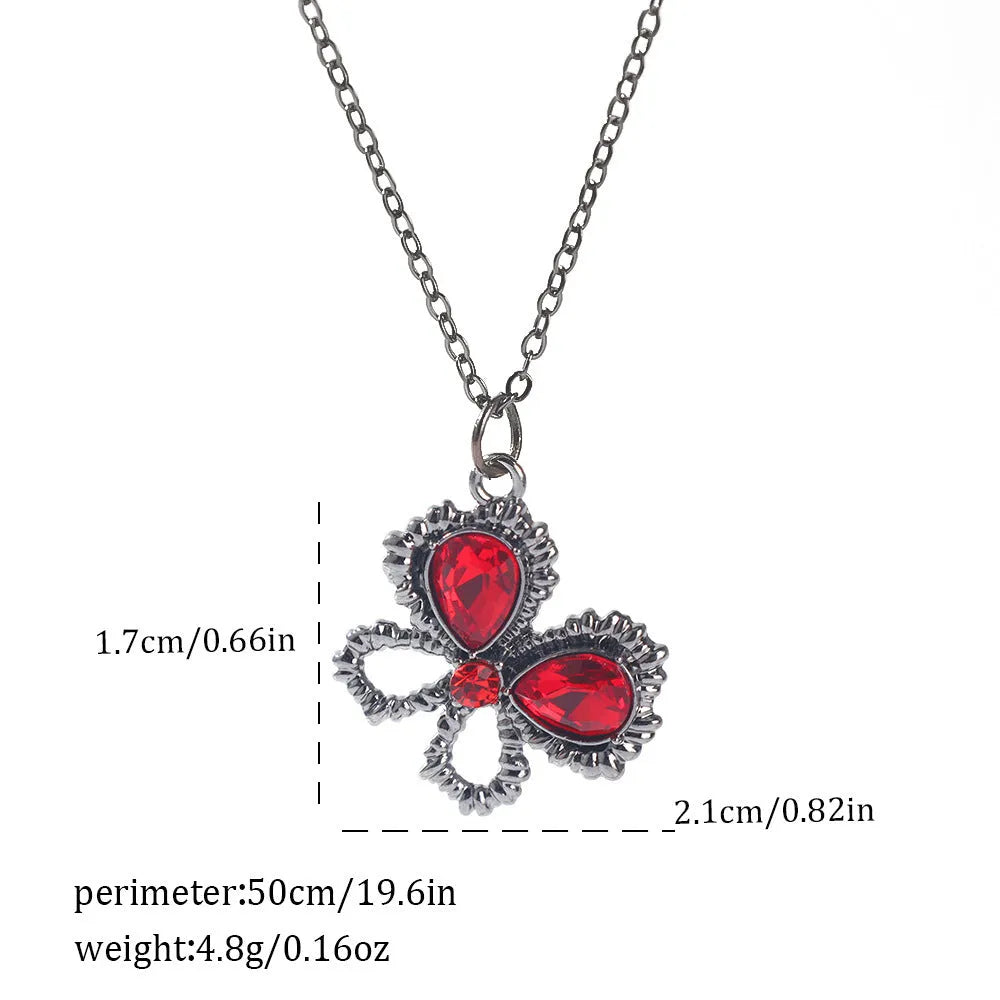Gothic Halloween necklace with spider and bat alloy pendant on a chain.