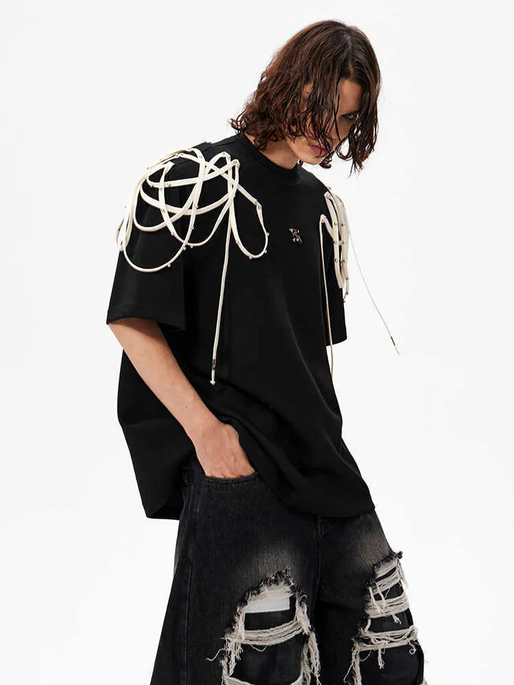 Black loose-fit short-sleeved t-shirt with padded shoulder detail and ribbed cotton texture.