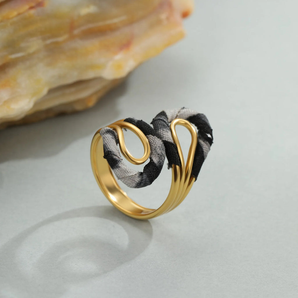 Stainless steel open mouth ring with leopard print and geometric designs including heart and star shapes