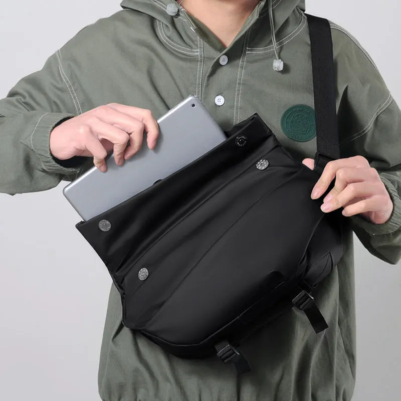 Grey PU crossbody bag showing front zipper compartment and adjustable shoulder strap