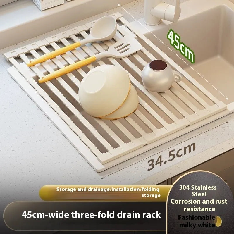 Milky white foldable stainless steel kitchen draining rack shown next to a sink.