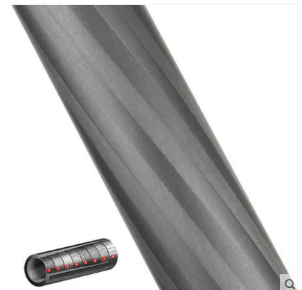 Black carbon fibre telescopic camera monopod extended to full height on a grey background.