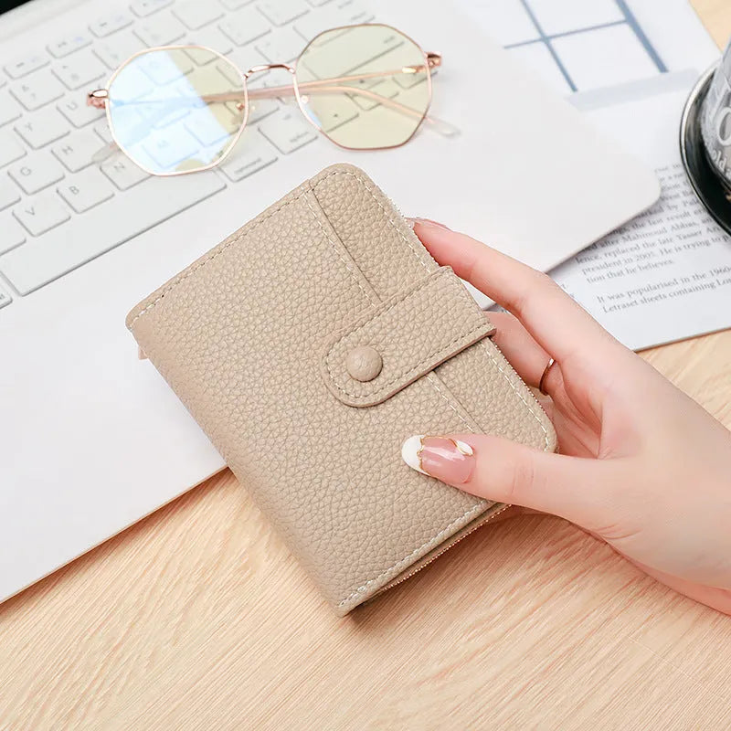 Ladies' short wallet with lychee pattern in beige, showing 2-fold design and card slots