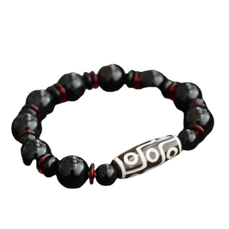 Hand-woven black agate and chalcedony dzi bead bracelet with geometric pattern