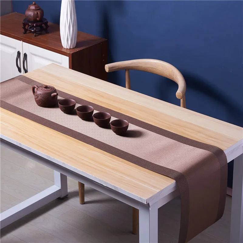 Modern PVC kitchen sink mat in a gradient bamboo colour on a countertop, showing its non-slip texture and size.