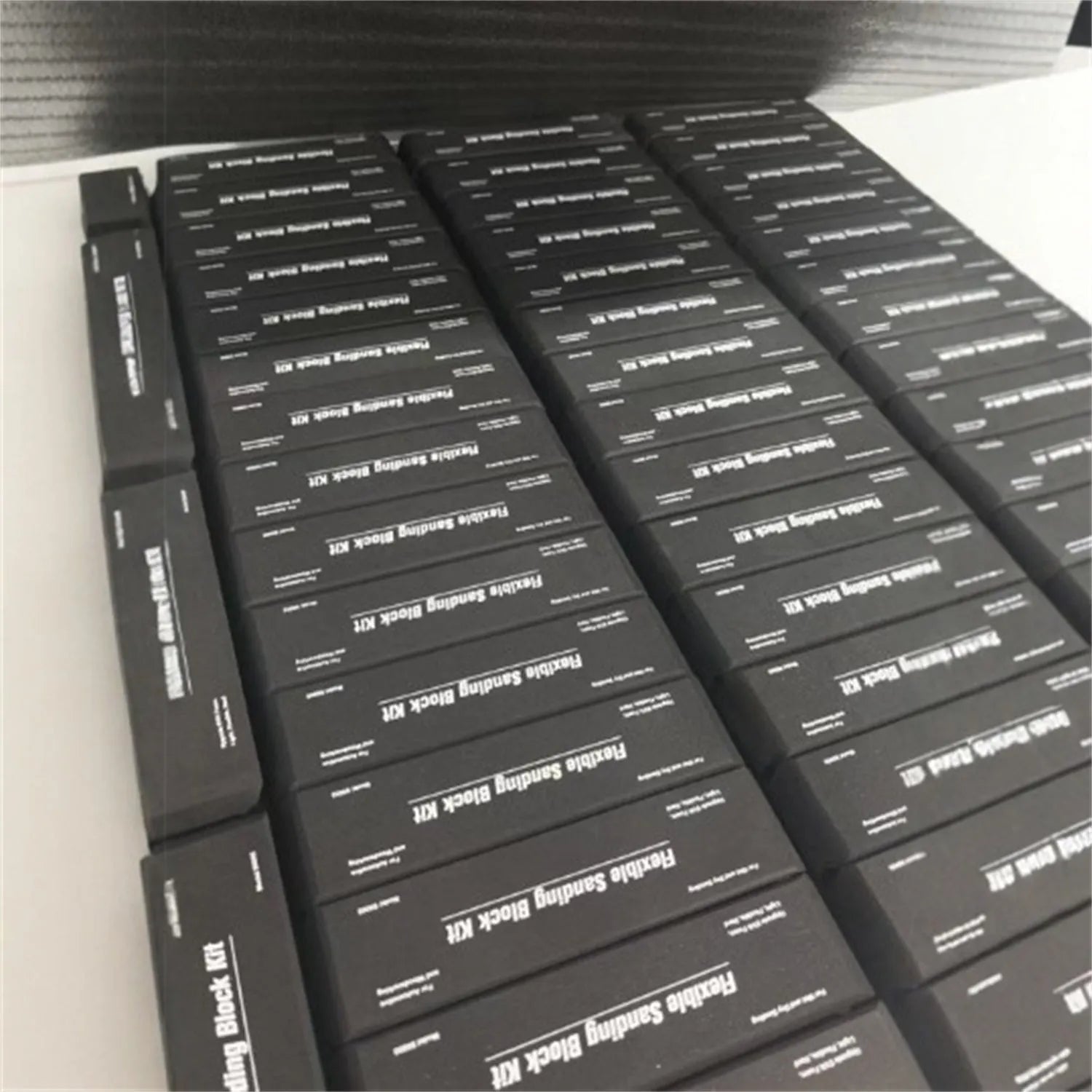 Set of seven black EVA frosted blocks for metal polishing and surface texturing.