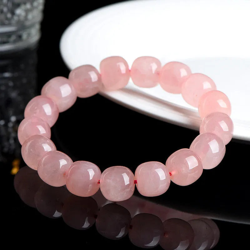 Natural pink crystal barrel-bead bracelet with 8x10mm polished geometry beads