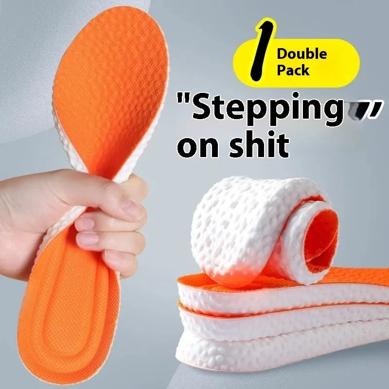 Grey, black, and orange breathable sports insoles made from soft PU material, shown alongside scissors for cut-to-fit sizing.