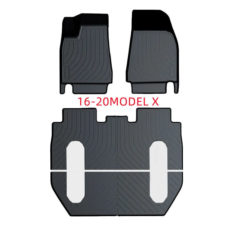 Custom rubber floor mats for Tesla cars with a textured TPE driver footrest section.