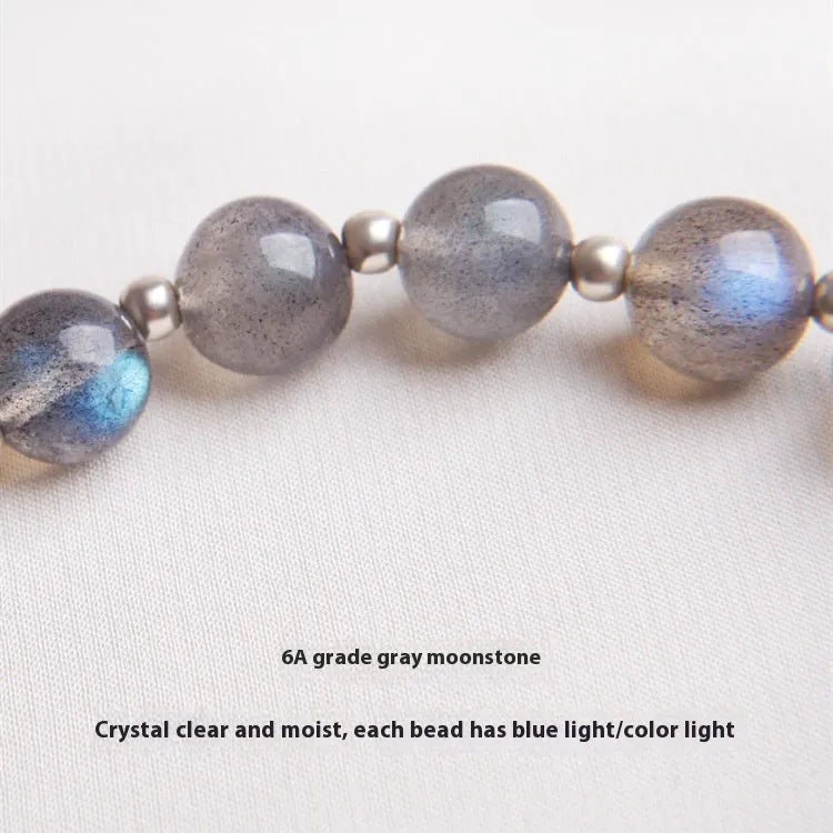 Women's 925 silver bracelet with grey moonlight stones and a honeysuckle animal charm.
