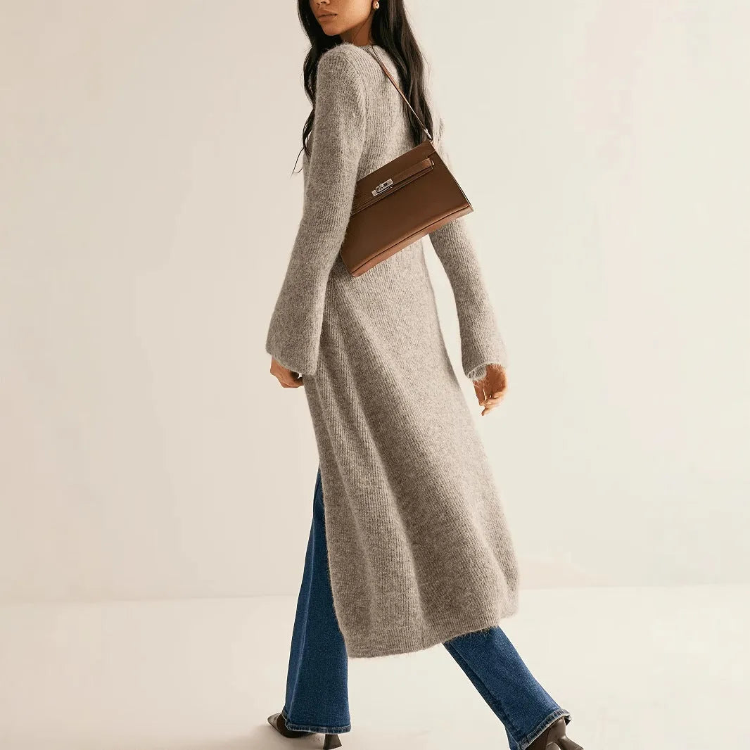 Khaki French retro long sleeve cardigan with button front on a model.