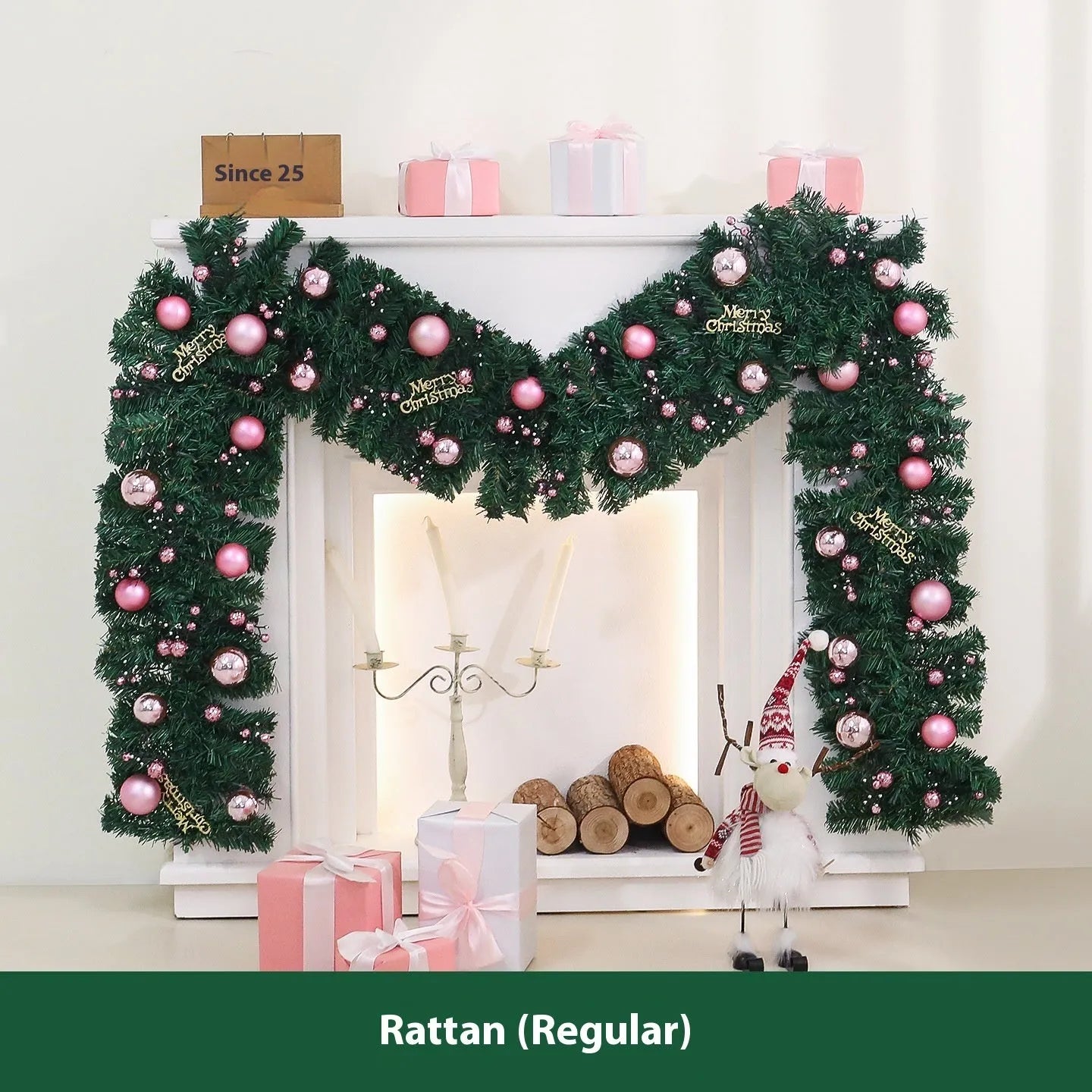 Pink artificial Christmas rattan vine garland with fairy lights draped on a mantelpiece