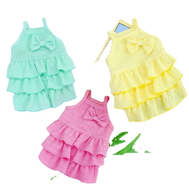 Small dog wearing princess dress with layered skirt in polyester fabric