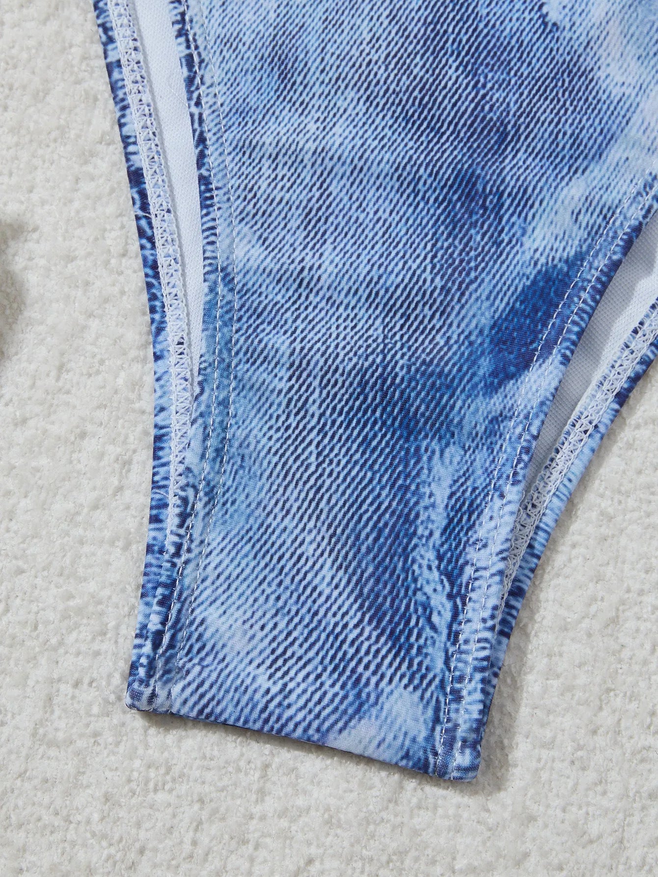 Women's blue denim print strappy bikini set, two-piece swimsuit on a white background.