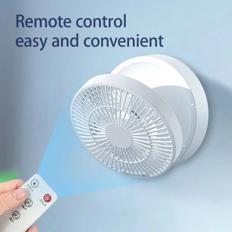 White portable USB rechargeable folding ceiling fan with remote control on desk