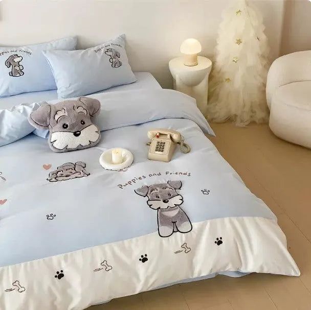 Schnauzer dog cartoon embroidered cotton bedding set with quilt cover, sheet, and pillowcases on a bed.