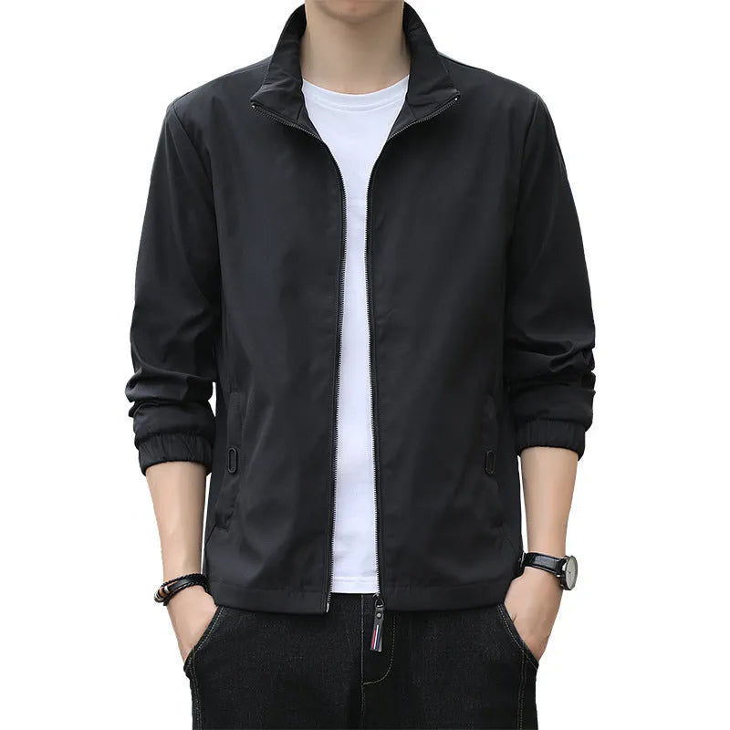 Korean style loose fit casual jacket in black with zip and patch pockets on a man.
