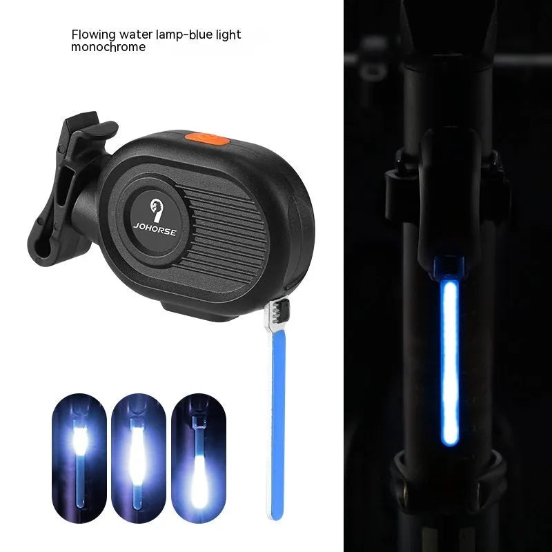 Bicycle taillight with colourful running water LED light effect mounted on a bike seat post.