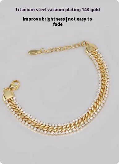 Gold tennis bracelet with stone detailing on titanium steel band