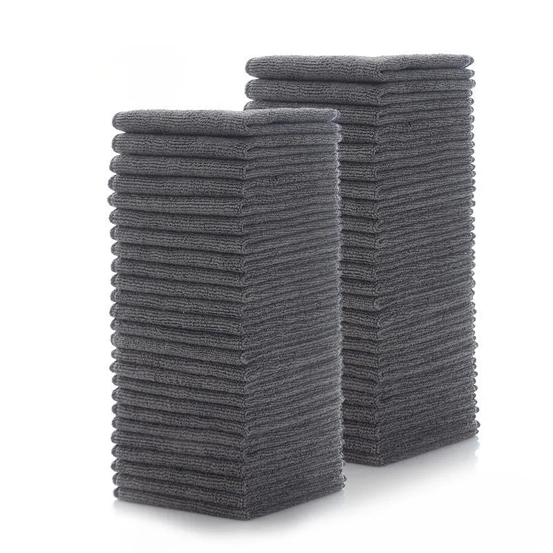 Grey square microfiber kitchen cleaning cloth for oilproof decontamination of pots and bowls.