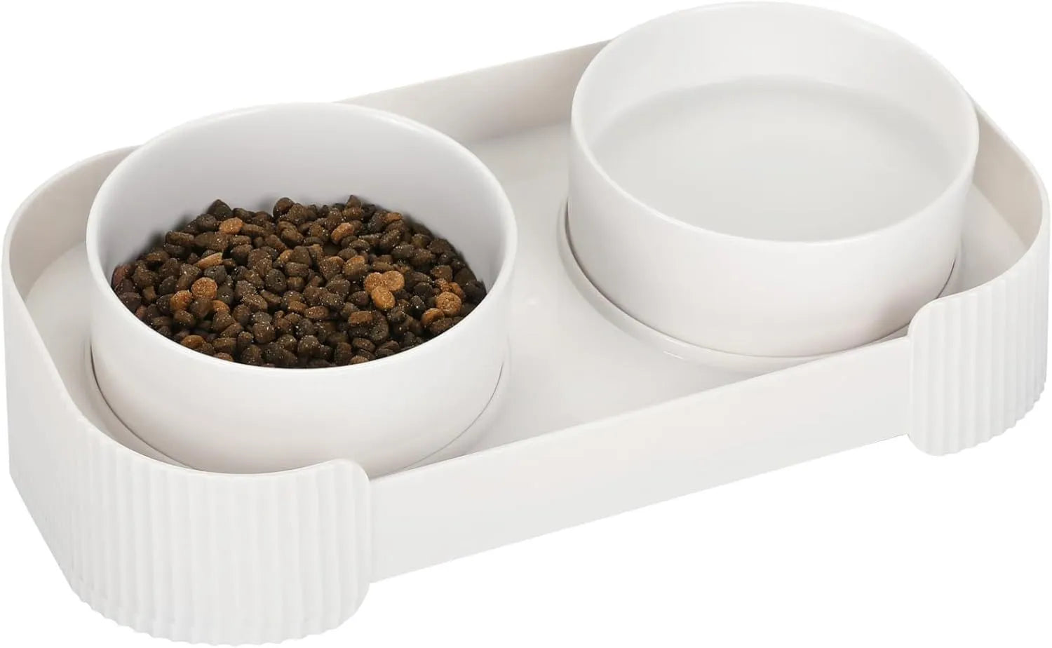 Green ceramic raised cat food and water bowls set with tilted stand on a kitchen floor.